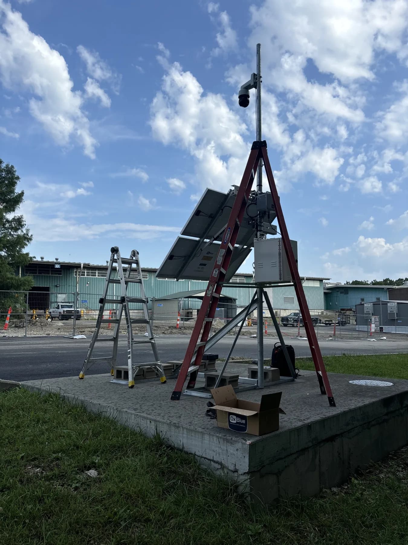 Solar-powered temporary surveillance camera installed at an active construction site