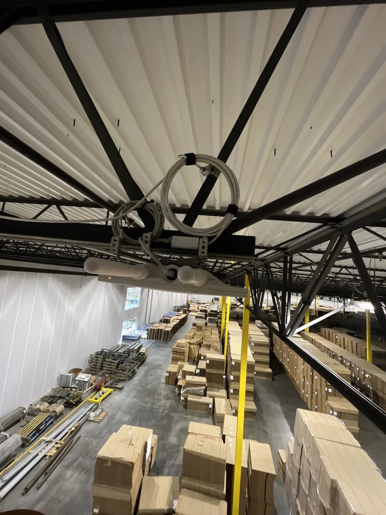 Wireless equipment installed high inside an active warehouse facility